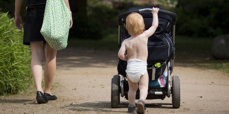 21-month old Kasper pushes his stroller through the Bethmannpark in Frankfurt Main, Germany, 20 June 2013. Photo by: Andreas Gebert/picture-alliance/dpa/AP Images