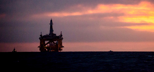FILE - In this April 17, 2015 file photo, an oil drilling rig arrives aboard a transport ship at sunrise, following a journey across the Pacific in Port Angeles, Wash. Royal Dutch Shell hopes to use the rig for exploratory drilling during the summer open-water season in the Chukchi Sea off Alaska's northwest coast, if it can get the permits. Royal Dutch Shell cleared a major hurdle Monday, May 11, 2015, when The Bureau of Ocean Energy Management approved Shell's exploration plan. However, this isn't the final step that Shell needs for Arctic drilling. (Daniella Beccaria/seattlepi.com via AP) MAGS OUT; NO SALES; SEATTLE TIMES OUT; TV OUT; MANDATORY CREDIT