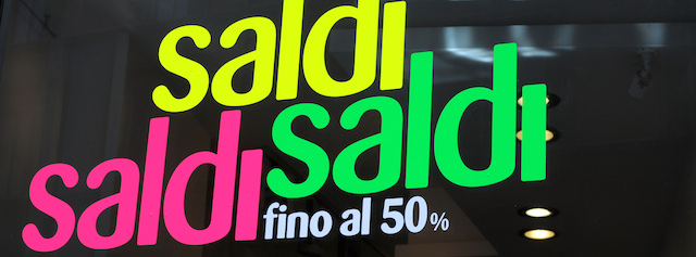 Stickers read '"sales up to 50%" in a shop window during the summer sales on July 8, 2013 in Rome. AFP PHOTO / BLAISE VIVEK (Photo credit should read BLAISE VIVEK/AFP/Getty Images)