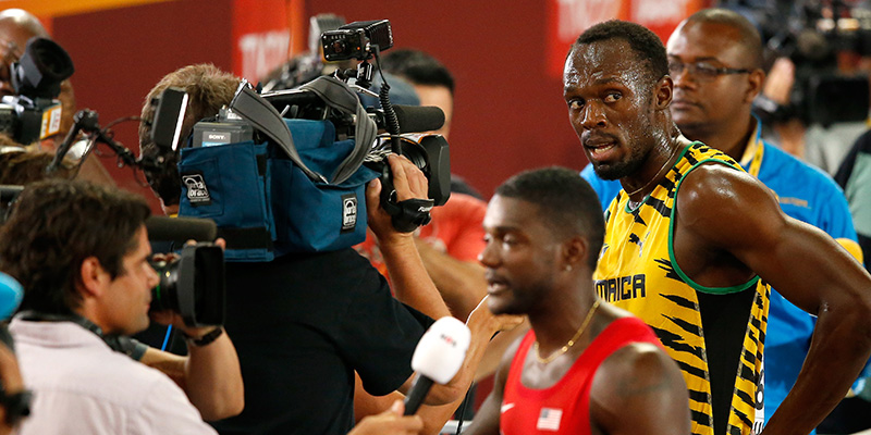Justin Gatlin e, dietro di lui, Usain Bolt, il 22 agosto a Pechino, in Cina (Christian Petersen/Getty Images for IAAF)