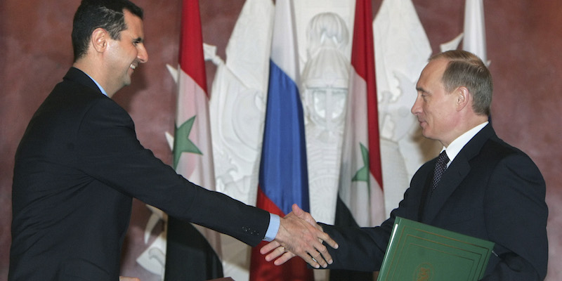 Il presidente siriano Bashar Assad e il presidente russo Vladimir Putin a Mosca il 25 gennaio 2005. (AP Photo/Sergei Chirikov, Pool)