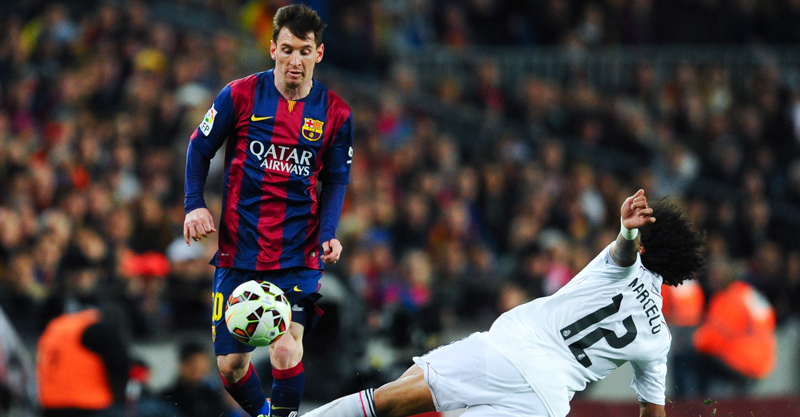 BARCELONA, SPAIN - MARCH 22: Lionel Messi of FC Barcelona competes for the ball with Marcelo Vieira of Real Madrid CF during the La Liga match Between FC Barcelona and Real Madrid CF at Camp Nou on March 22, 2015 in Barcelona, Spain. (Photo by David Ramos/Getty Images)