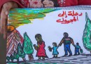 A Idomeni una bambina sta raccontando la sua storia con i disegni
