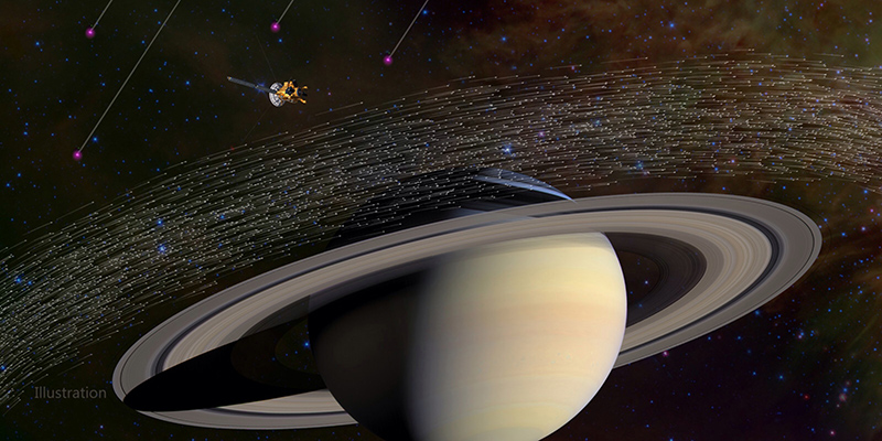 La sonda Cassini nei pressi di Saturno poco prima di essere colpita da alcuni granelli di polvere interstellare, in un’elaborazione grafica (NASA)