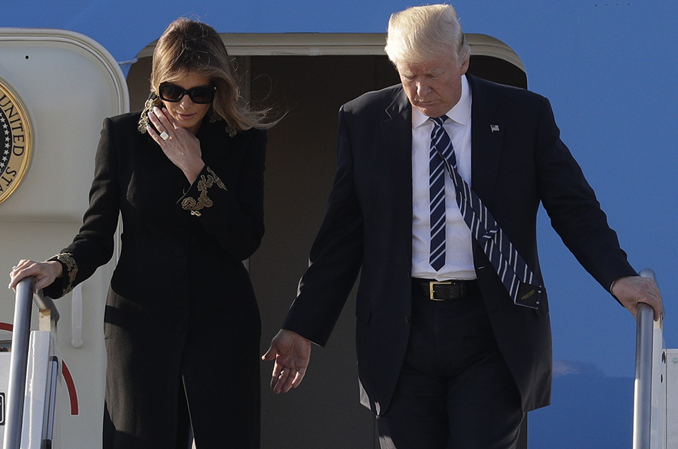 US President Donald Trump and his wife Melania arrive at Fiumicino's Leonardo Da Vinci International airport, near Rome, Tuesday, May 23, 2017. Trump is in Italy for a two day visit, including a meeting with Pope Francis at the Vatican, ahead of his participation in a NATO summit in Brussels on Thursday. (AP Photo/Andrew Medichini)