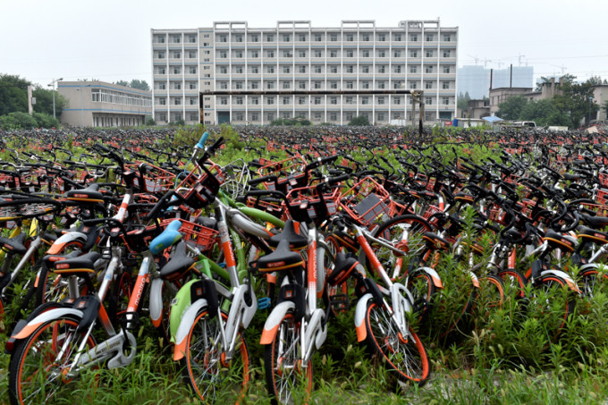 Mountain of bicycles of bike-sharing occupies playground in E China's school