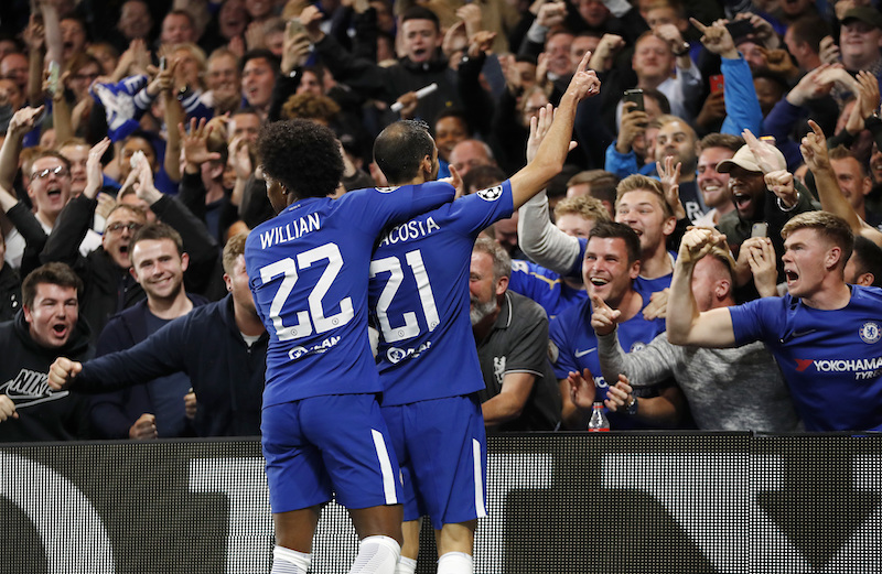 Chelsea's Davide Zappacosta, right, celebrates with his teammate Willian after scoring during the Champions League group C soccer match between Chelsea and Qarabag at Stamford Bridge stadium in London, Tuesday, Sept. 12, 2017. (AP Photo/Kirsty Wigglesworth)