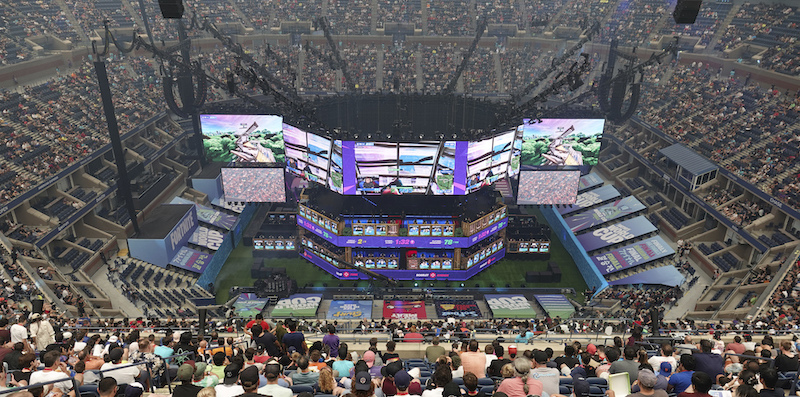 27 July 2019, US, New York: Spectators follow the Fortnite World Cup at the Arthur Ashe Tennis Stadium. At the World Cup almost 200 young people will fight for prize money of 30 million dollars. Photo by: Benedikt Wenck/picture-alliance/dpa/AP Images
