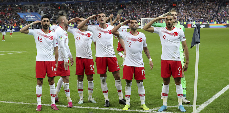 Turkey's players salute as they celebrate a goal against France during the Euro 2020 group H qualifying soccer match between France and Turkey at Stade de France at Saint Denis, north of Paris, France, Monday, Oct. 14, 2019. (AP Photo/Thibault Camus)