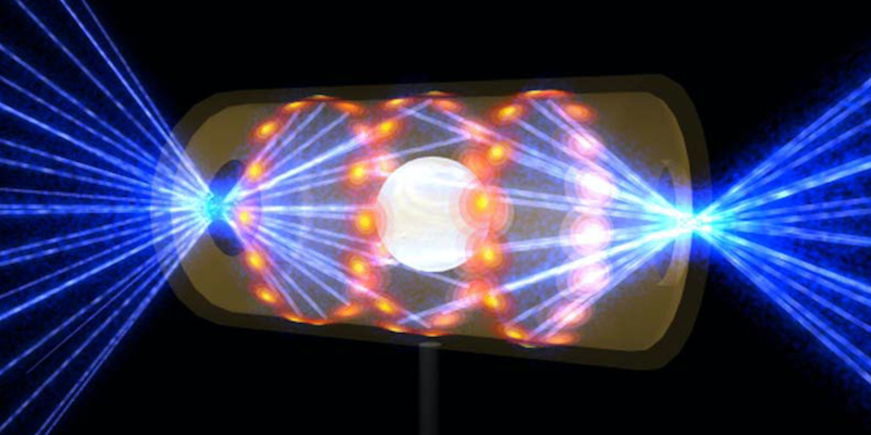 Un'illustrazione che rappresenta il bersagliamento di un nucleo atomico da parte di raggi laser per raggiungere le condizioni necessarie alla fusione nucleare (Lawrence Livermore National Laboratory via AP)