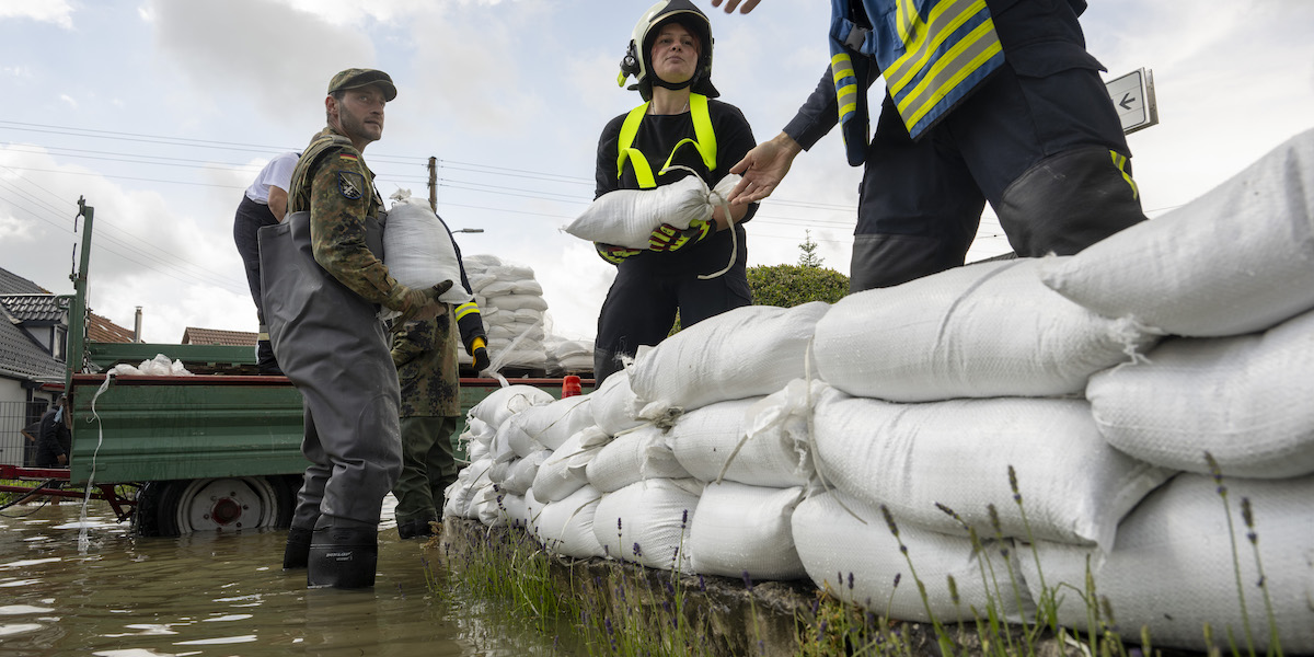 A firefighter has died and two individuals are lacking following floods in southern Germany
